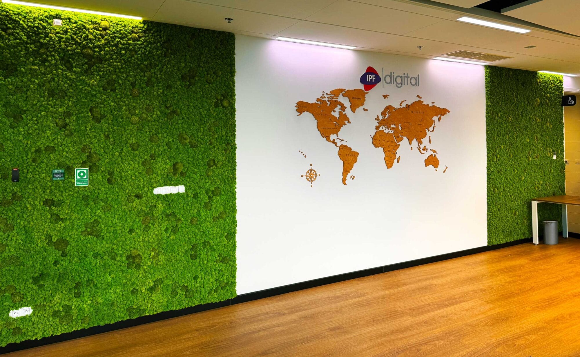 Reindeer Moss Wall And Wooden World Map In An Office
